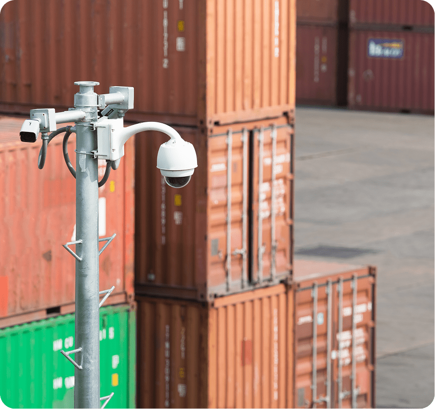 Security camera overlooking shipping containers.
